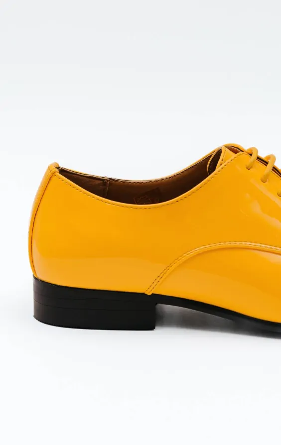 Yellow patent leather shoes top